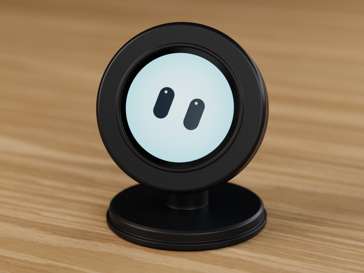 Desktop Bot on a wooden desk: a round black device with a glowing light-blue screen and two oval eyes, mounted on a slim black post with a round base